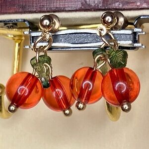Gold studded earrings with cranberry charms
